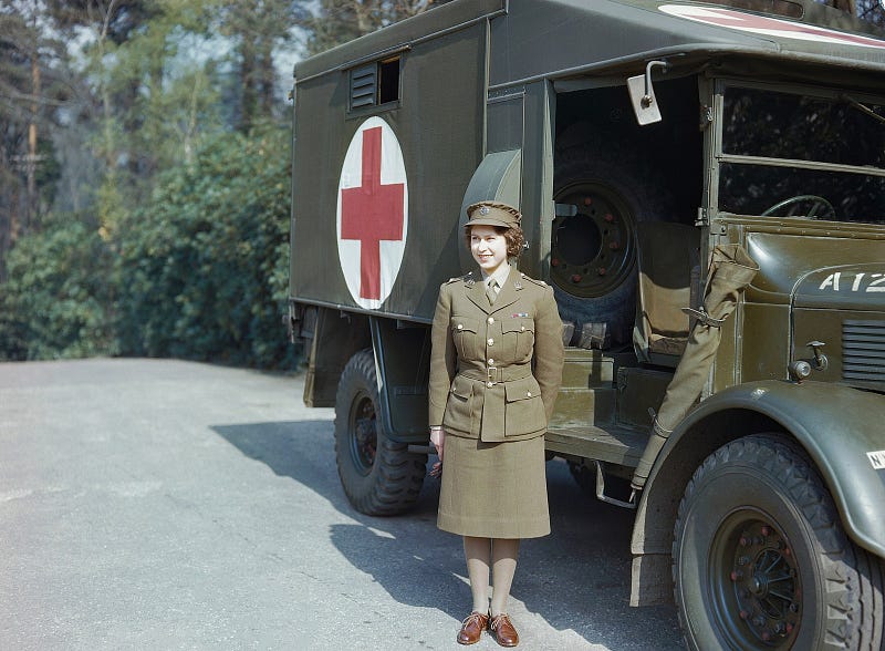 Princess Elizabeth stands outside a medic jeep in 1945.